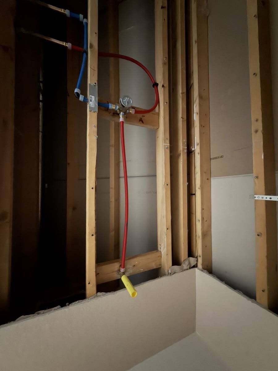 Bathroom plumbing PEX valve rough-in — Denver remodel by Gribbons Group Corp