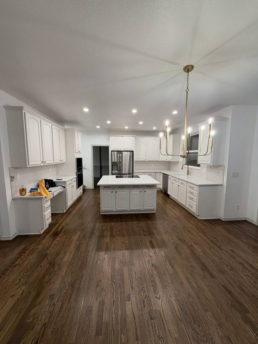 White kitchen island and cabinets — Denver kitchen remodel by Gribbons Group Corp
